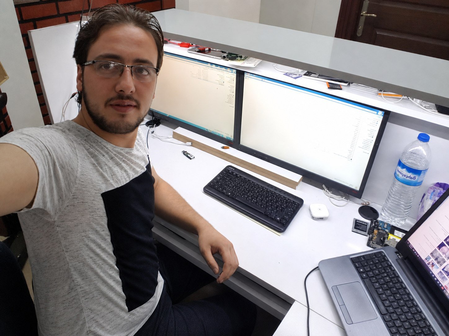 Basel at a two-monitor repair workstation in Turkey.