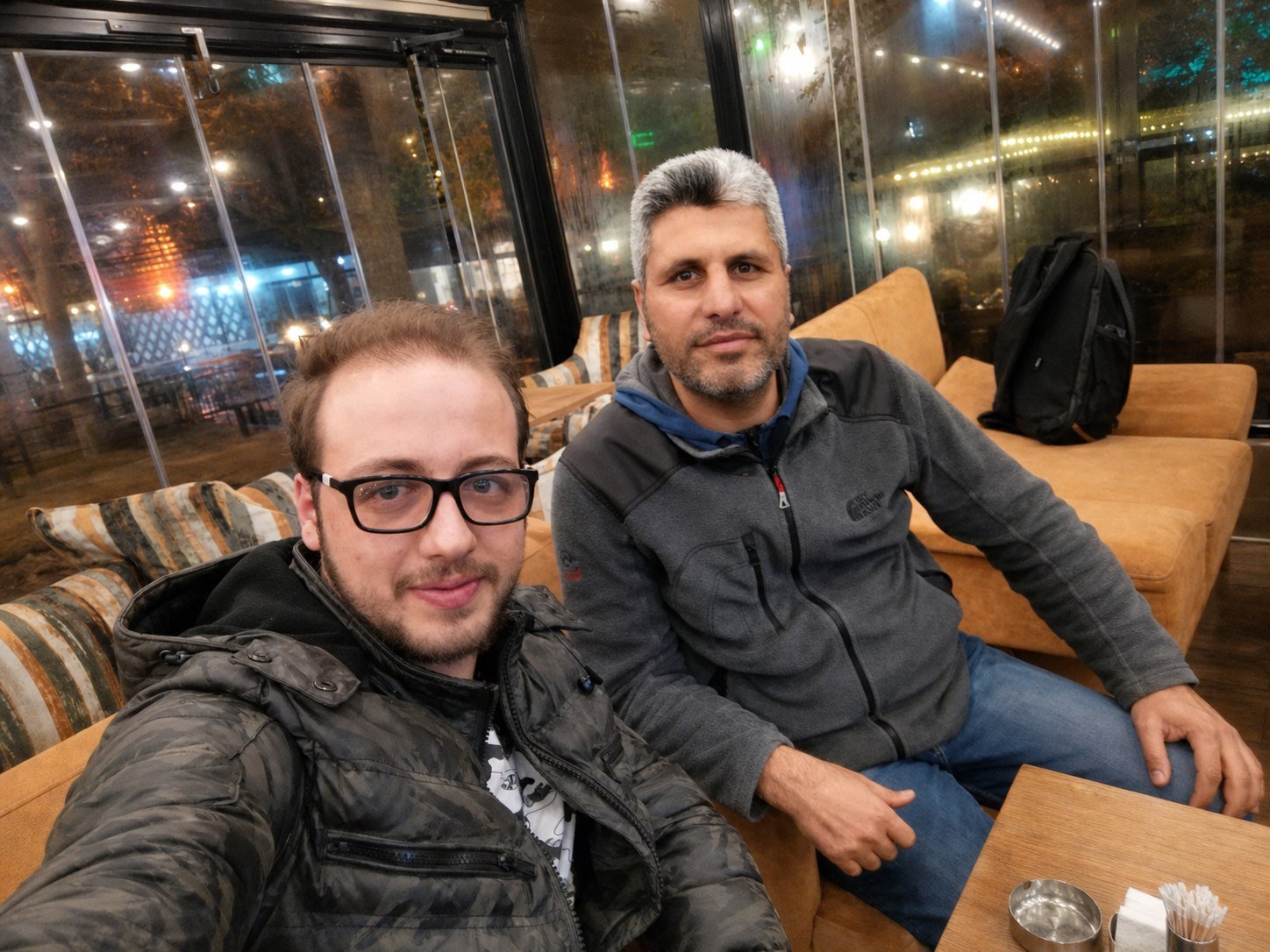 Basel at a café with the man who helped him find his footing in Turkey.